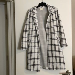 Black and white coat made for styling not to keep you warm. Worn once